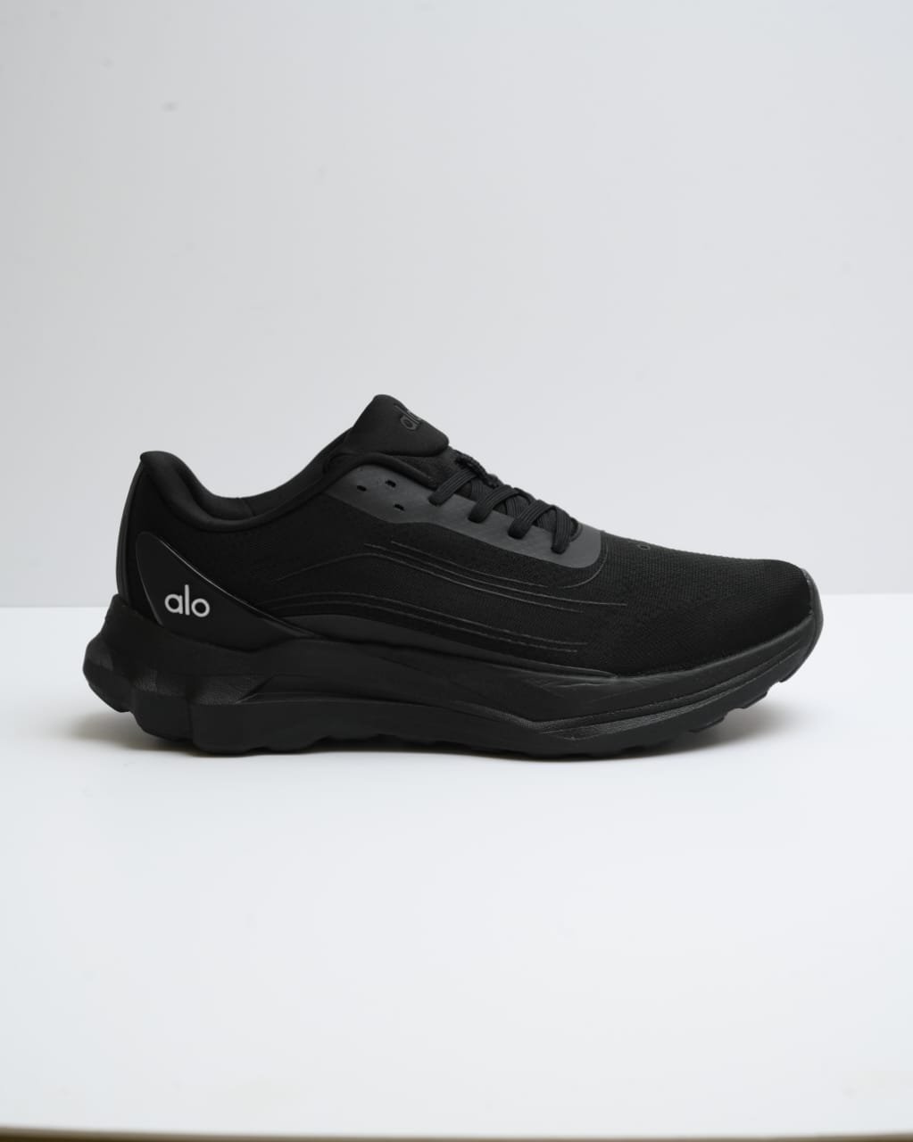 Alo Runner sneaker in the black black color